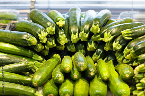 Fresh zucchini in supermarket. Concept of healthy food, bio, vegetarian, diet. photo