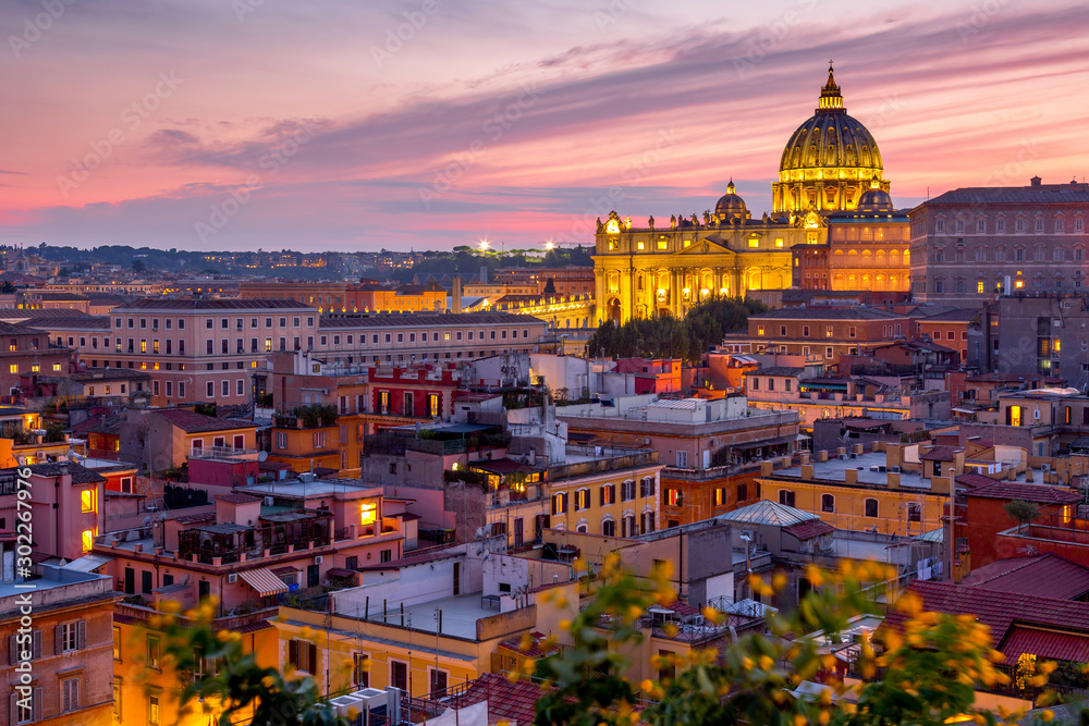 Cityscape view of Rome at sunset with St Peter Cathedral in Vatican.