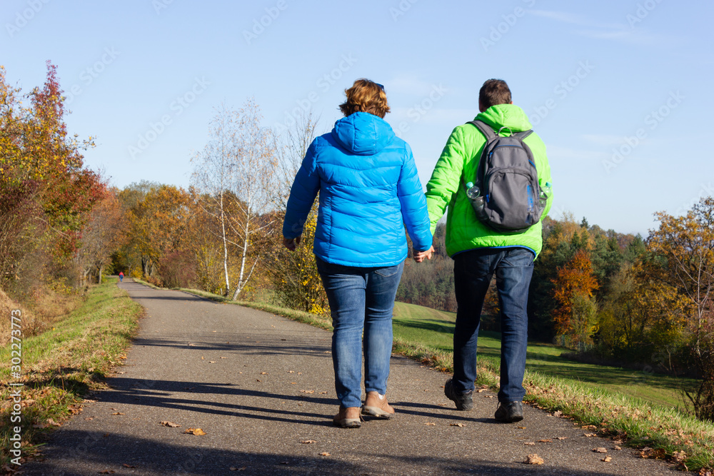 couple walking in fall