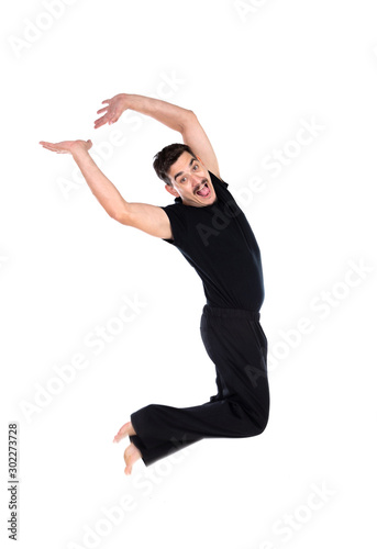 Casual man in black jumping of joy