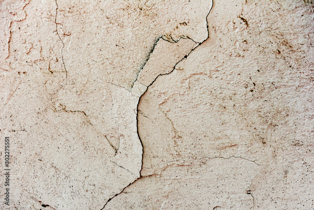 Obraz premium Texture of a concrete wall with cracks and scratches which can be used as a background