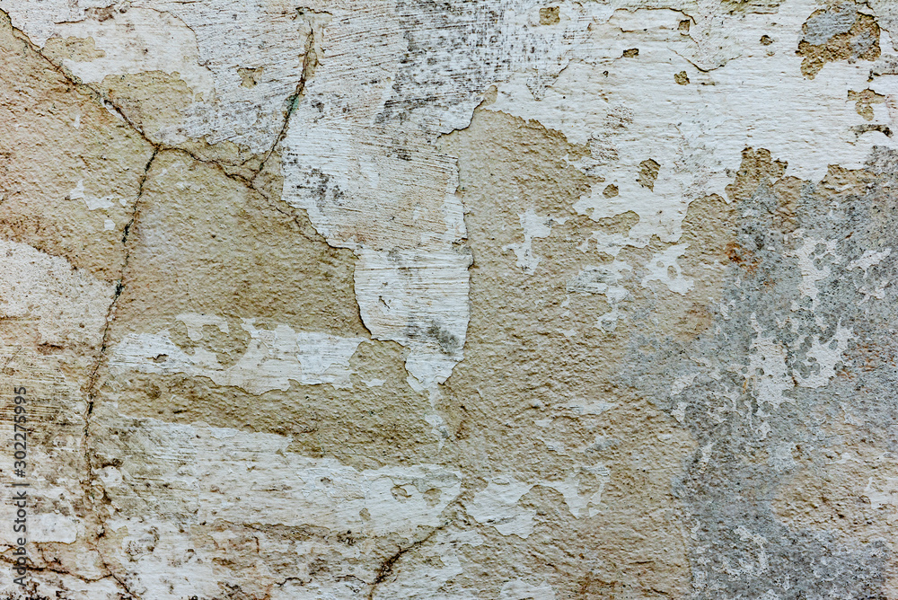 Fototapeta premium Texture of a concrete wall with cracks and scratches which can be used as a background