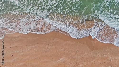 AERIAL SHOT General beaches CRIMEAU KERCH SEPTEMBER 2019 SEA of AZOV top view of the tide with green waves and yellow shore