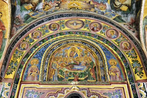 Frescoes of the Troyan Monastery (Monastery of the Dormition of the Most Holy Mother of God). It is the third largest monastery in Bulgaria and is located in the Balkan mountains. It was founded in the 16th century. The exterior murals were painted by Zahari Zograf. Bulgaria photo