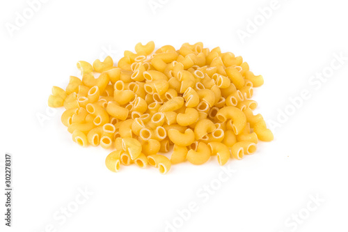 PIle of yellow dried elbow macaroni pasta shapes