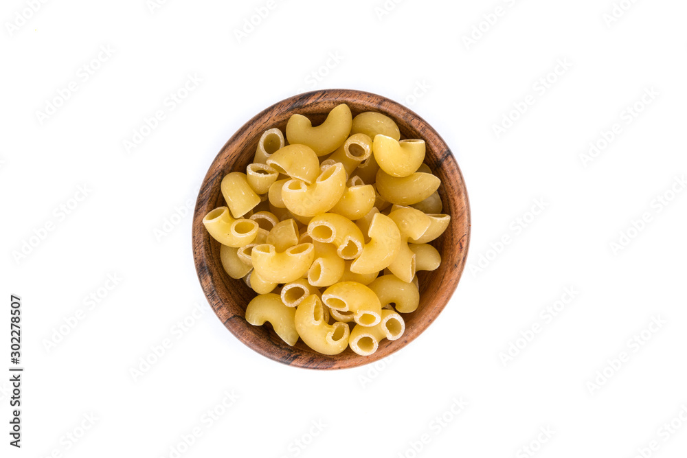 PIle of yellow dried elbow macaroni pasta shapes