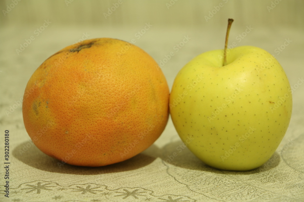 two apples on wooden table