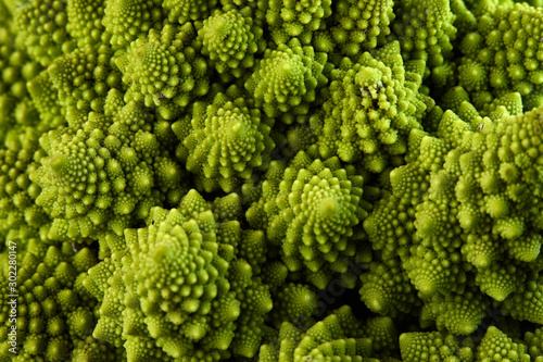 Romanesco broccoli or Roman cauliflower, close up shot from above, texture detail of the healthy vegetable Brassica oleracea, a variation of cauliflower. macro photo