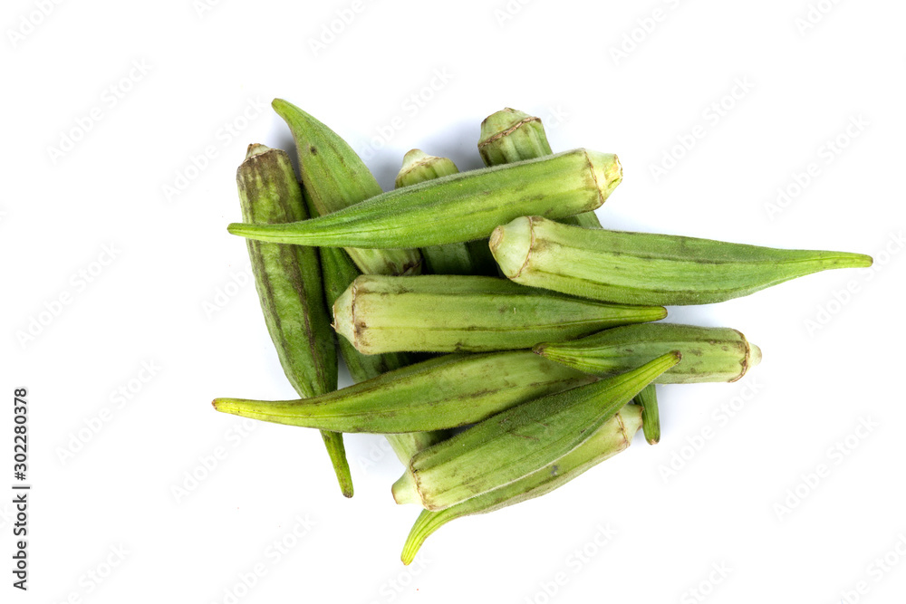 Pile of raw whole okra on a white background Pile of raw whole okra on a white background