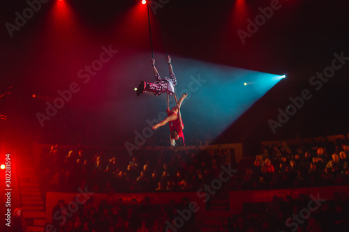 performance of aerialists in the circus arena.