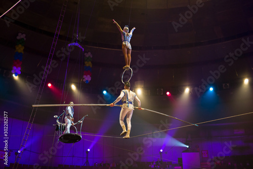performance of aerialists in the circus arena.