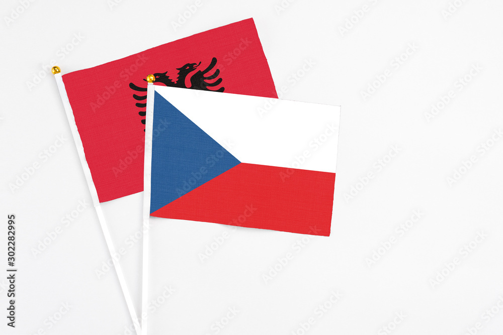Czech Republic and Albania stick flags on white background. High quality fabric, miniature national flag. Peaceful global concept.White floor for copy space. Czech Republic and Albania stick flags on white background. High quality fabric, miniature national flag. Peaceful global concept.White floor for copy space.