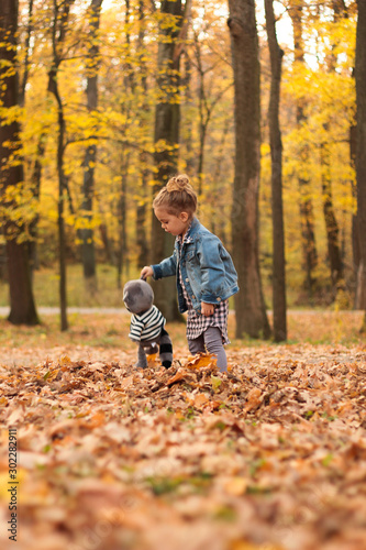 little girl in autumn park © Igor