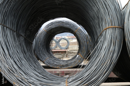 roll of metal wire on truck, building metal materials, iron wires under the sky for construction