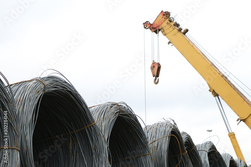 roll of metal wire on truck, building metal materials, iron wires under the sky for construction