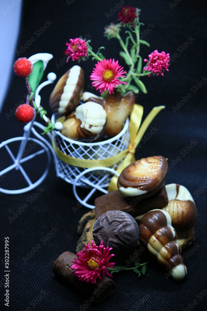 composition with chocolate and flowers composition with chocolate and flowers