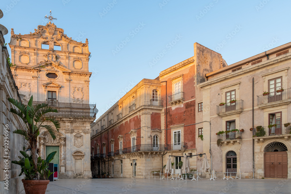 Central street of the Ortigia island  at sunrise in the province of Siracusa in Sicily, south Italy