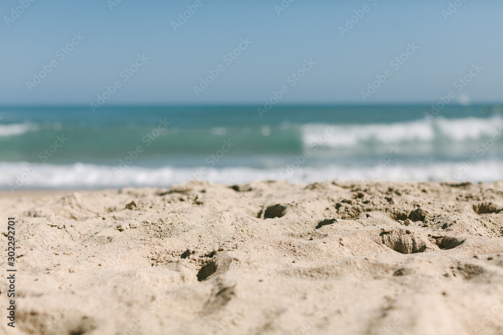 beaches sand in focus ocean view and waves summer day beaches sand in focus ocean view and waves summer day