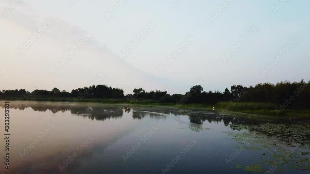 aerial view of boat on the river at sunrise, sunrise on the river, Fisherman on the boat on the sunrise aerial, aerial view of morning fishing, fly above motorboat at sunrise aerial view of boat on the river at sunrise, sunrise on the river, Fisherman on the boat on the sunrise aerial, aerial view of morning fishing, fly above motorboat at sunrise