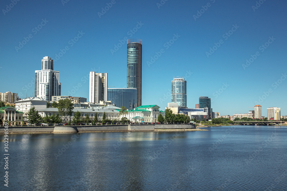 Fototapeta premium Yekaterinburg city center skyline and Iset river. Ekaterinburg is the fourth largest city in Russia and the centre of Sverdlovsk Oblast. Summer day.
