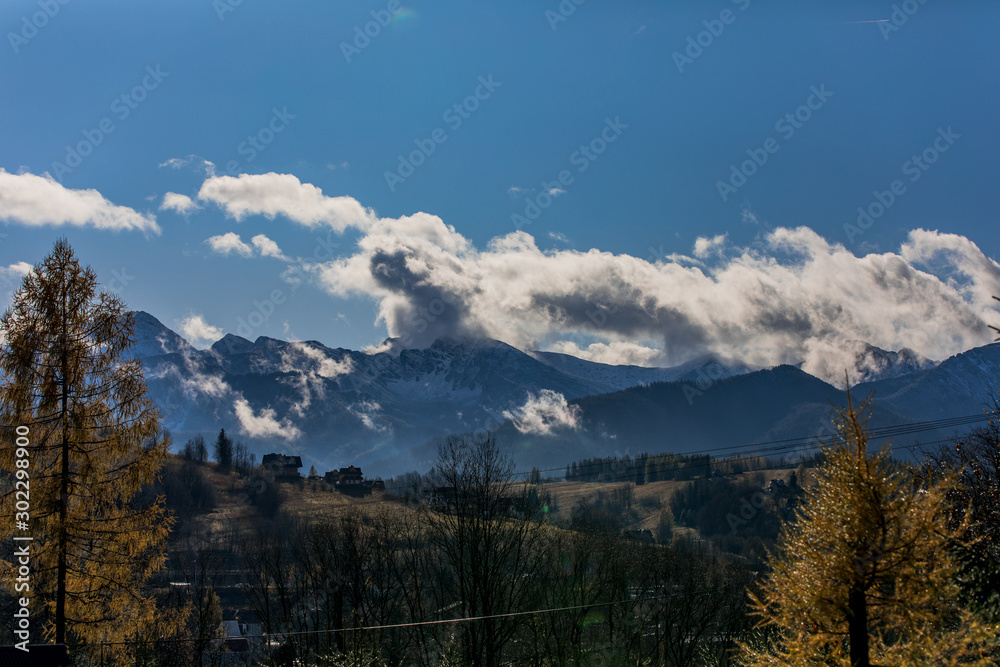 Fototapeta premium HDR photo of the Tatra Mountains and Great Giewont Peak with the steel Cross between clouds.
