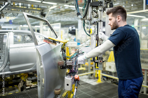 Man working in modern car factory