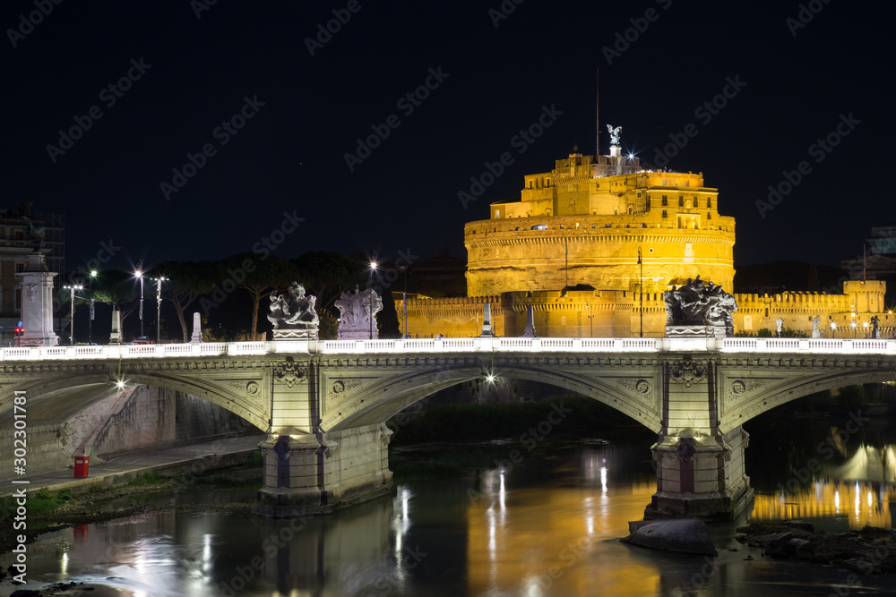 reflections of the vittorio emanuele II bridge and Castel Sant'Angelo sul tevere