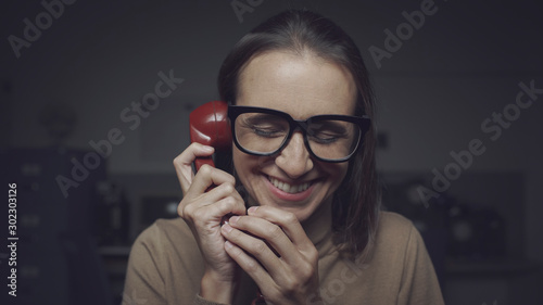 Happy woman chatting on the phone photo