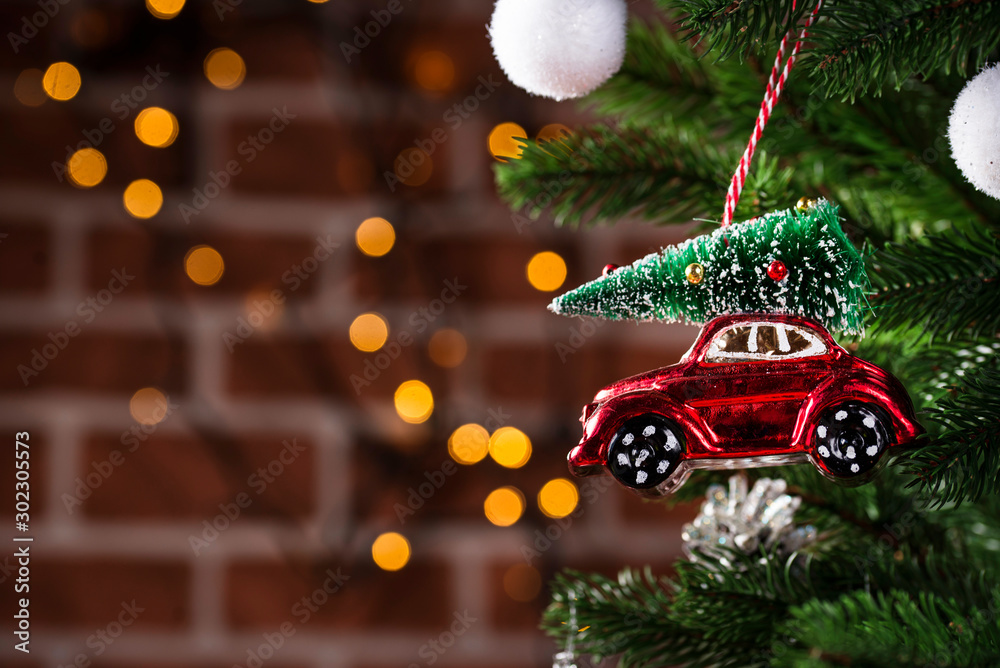 Christmas tree toy in shape of red car - obrazy, fototapety, plakaty 