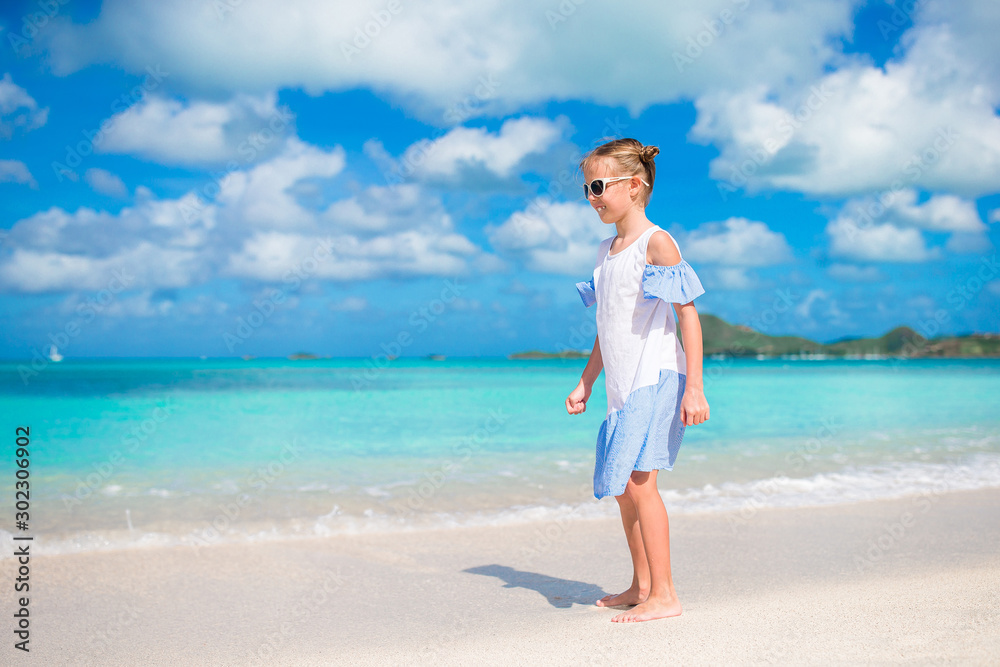 Cute little girl at beach during caribbean vacation Cute little girl at beach during caribbean vacation