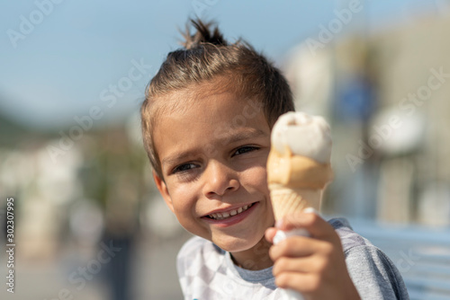 The boy eating a delicious ice cream