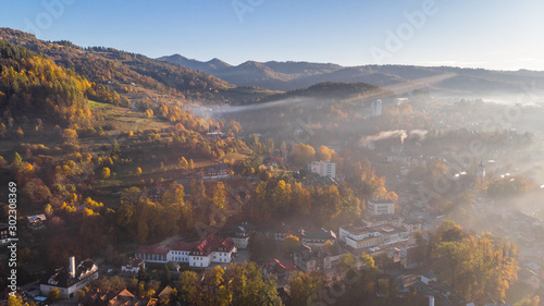 Foggy Sunrise Over Szczawnica City in Pieniny Mountains at Fall Season. Drone View