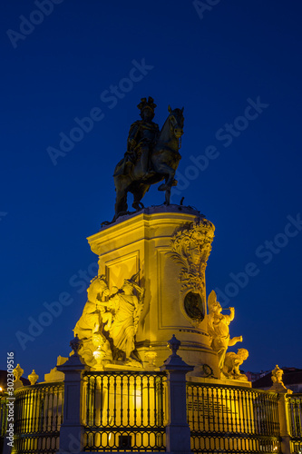 Illuminated statue of King Jose I at the Praca do Comercio square in Baixa district in Lisbon  Portugal  in the evening.