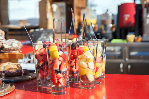 glass with fruit dessert in the bar outdoors