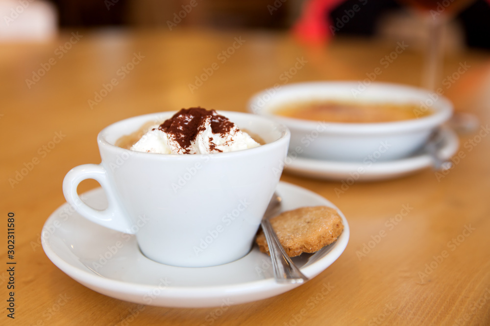 coffee with cream and dessert on the table in cafe coffee with cream and dessert on the table in cafe