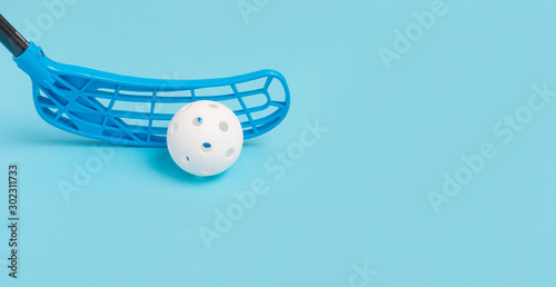Принти на полотні floorball stick and white ball isolated on blue background
