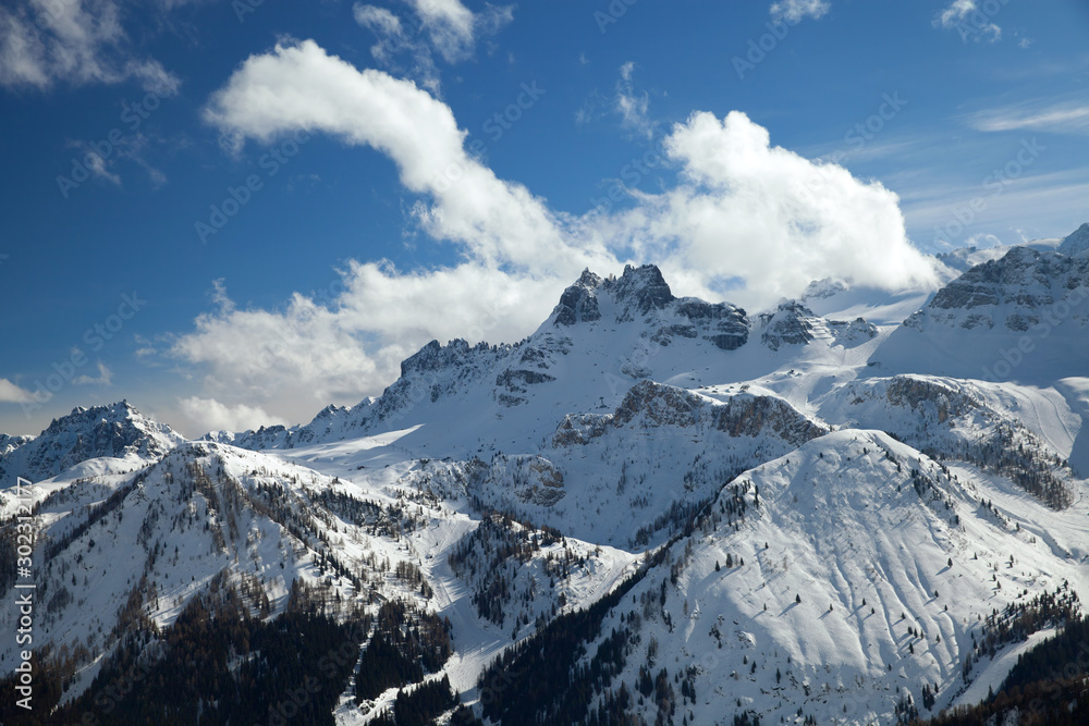 mountain range in winter against the blue sky