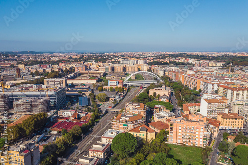 Aerial view of Rome Italy residential areas with houses, flight on drone above city buildings in sunny day. © DedMityay