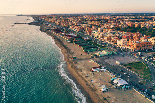 Aerial view of Ostia beach near Rome, Italy. Beautiful sea, coast and city view from above, drone photo.