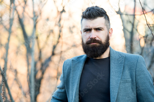 Fine grooming for modern savage. Bearded man with brutal beard. Hipster wear long beard and mustache in brutal style. Lumberjack look of modern businessman. Brutal and bearded. Barbershop