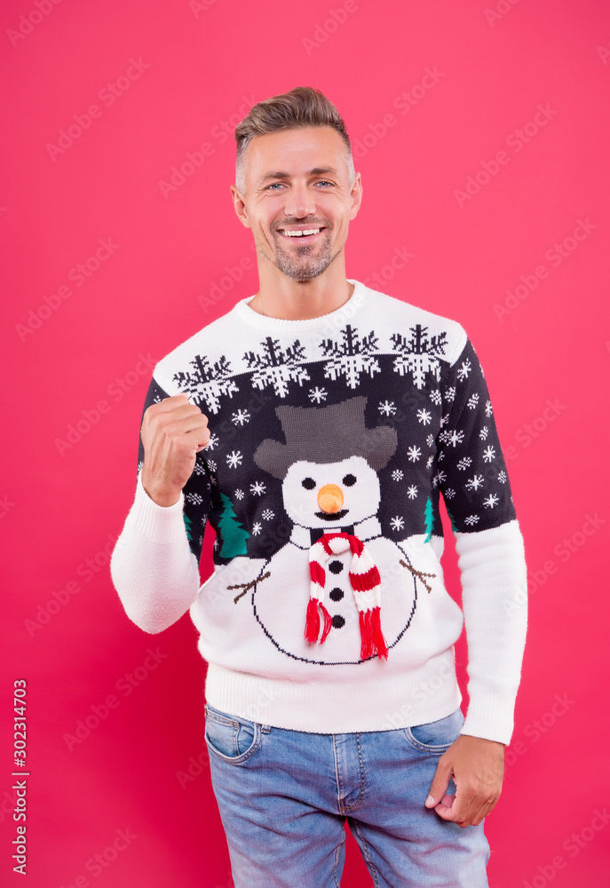 Cheerful mood. Handsome man wear winter sweater with snowman. Traditional sweater for holidays. Smiling mature guy having fun. Snowflakes pattern. Knitwear concept. Funny sweater. Menswear