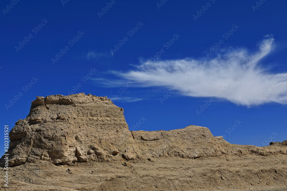 Cirrus uncinus cloud over wind-eroded trailer van-shaped yardang. Qaidam desert-Qinghai-China-0587 Cirrus uncinus cloud over wind-eroded trailer van-shaped yardang. Qaidam desert-Qinghai-China-0587