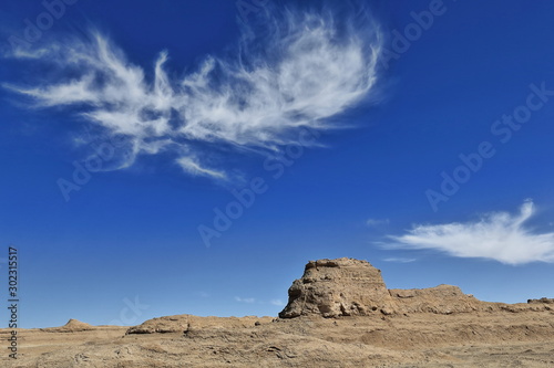 Cirrus uncinus clouds over wind-eroded trailer van-shaped yardang. Qaidam desert-Qinghai-China-0586