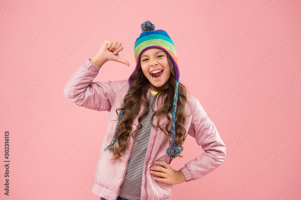 cool day. small girl winter hat. ready for winter activity. cheerful child pink background. autumn style. happy childhood. kid fashion and shopping. trendy girl smiling. warm clothes for cold season