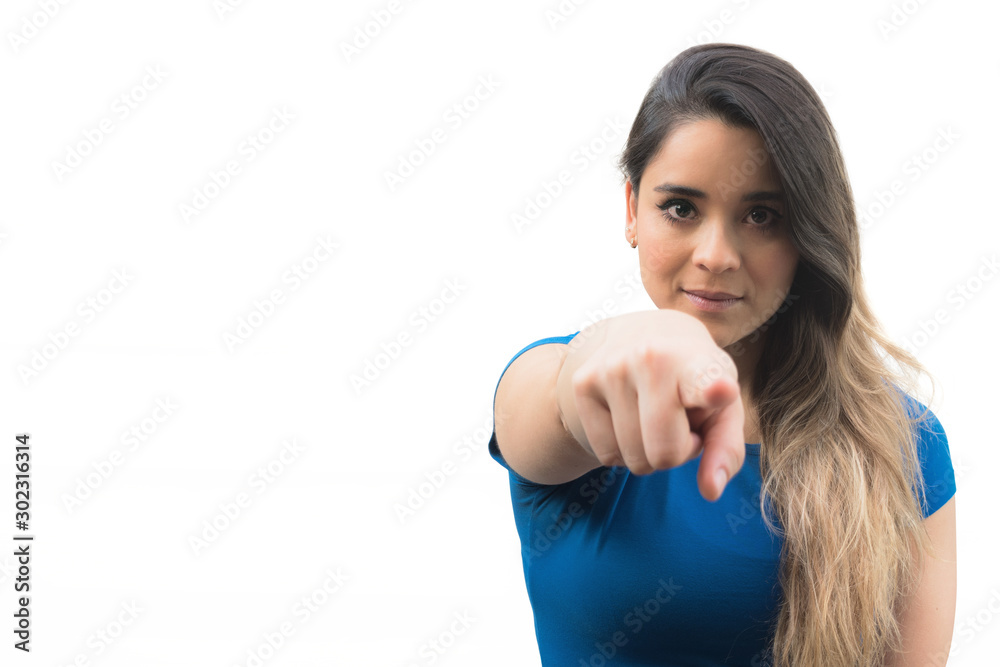 Isolated young woman pointing her finger towards the camera Isolated young woman pointing her finger towards the camera