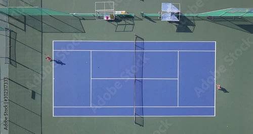Sports activity: Tennis match - Top down aerial view.