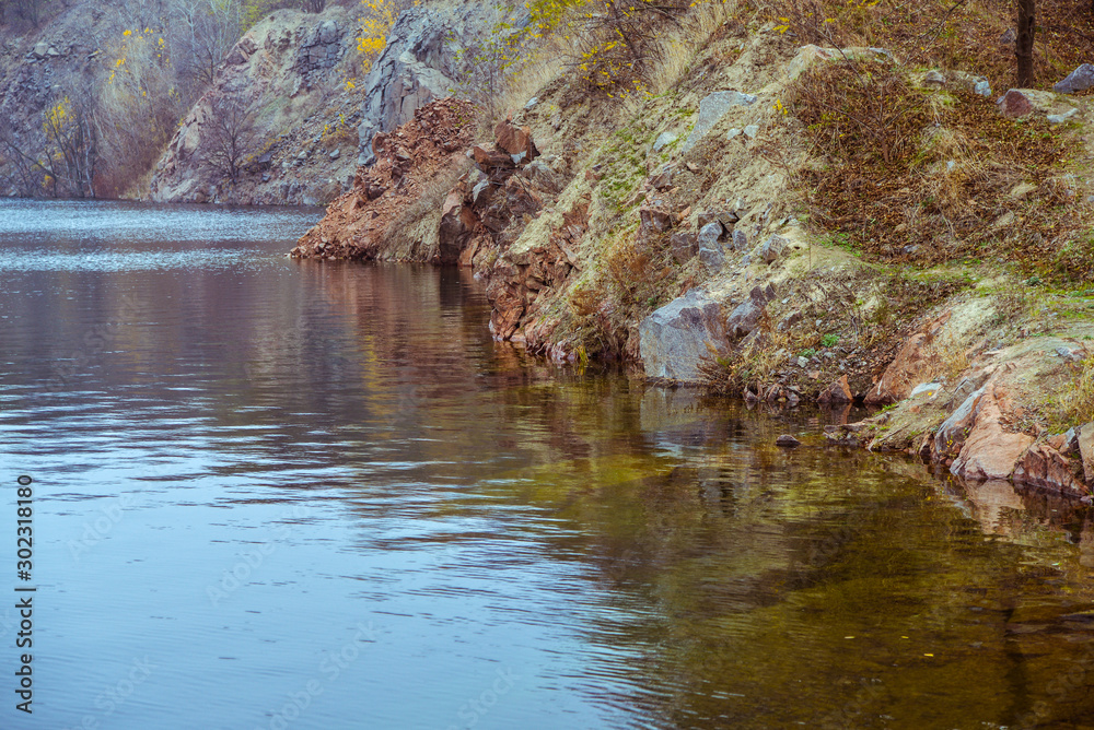 Rocks in autumn lake