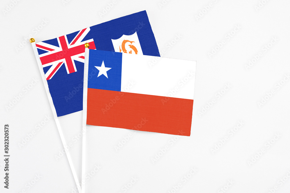 Chile and Anguilla stick flags on white background. High quality fabric, miniature national flag. Peaceful global concept.White floor for copy space. Chile and Anguilla stick flags on white background. High quality fabric, miniature national flag. Peaceful global concept.White floor for copy space.