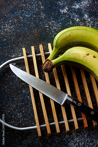 PLATANS ON WOOD GRILLE AND KITCHEN KNIFE photo