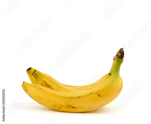 ripe yellow bananas in a peel on a white background